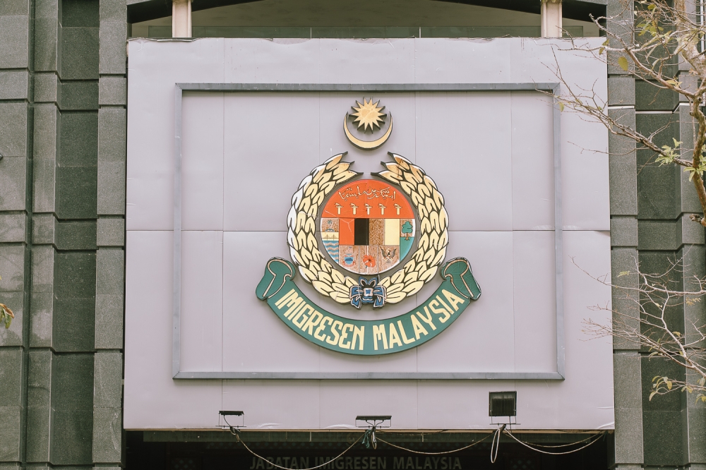 Immigration raids dismantle passport forgery ring in Kuala Lumpur, three arrested with 119 fake documents seized