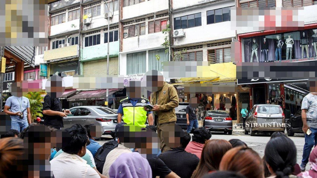 Immigration officers net 111 undocumented migrants in Jalan Kenanga clothing district sweep