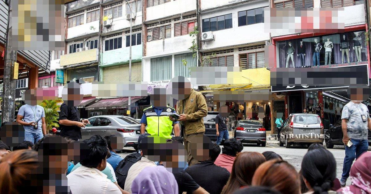Immigration officers net 111 undocumented migrants in Jalan Kenanga clothing district sweep