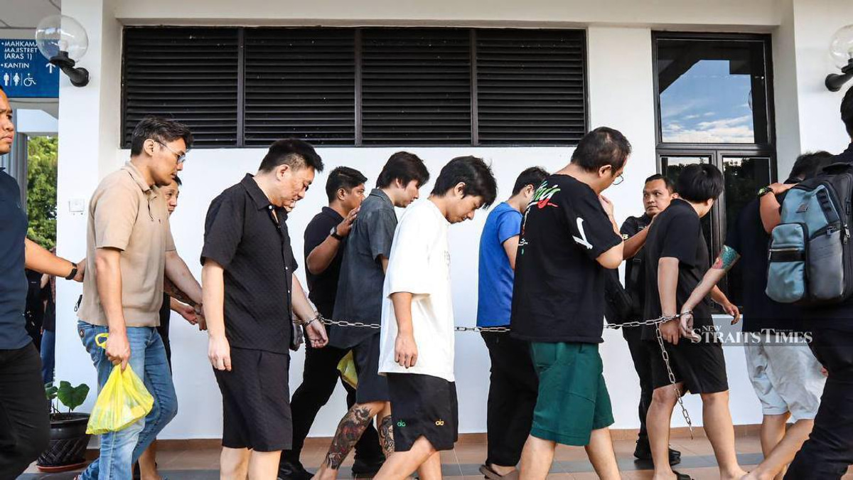Nine Chinese nationals charged over alleged romance scam operation in Malaysia