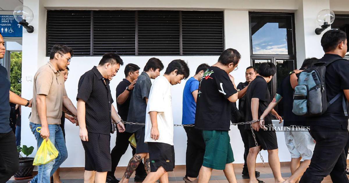Nine Chinese nationals charged over alleged romance scam operation in Malaysia