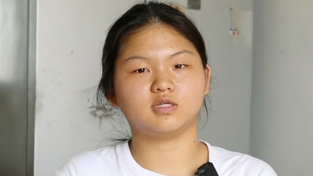 Orphaned Chinese student's grace in adversity strikes chord with nation