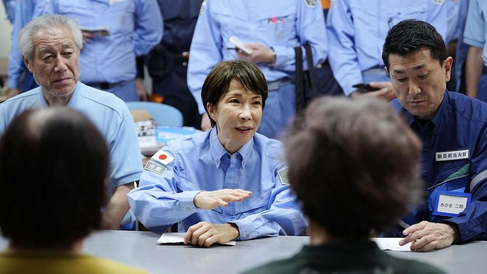 Japan's PM visits quake-devastated Kumamoto as heat and shortages compound disaster relief crisis