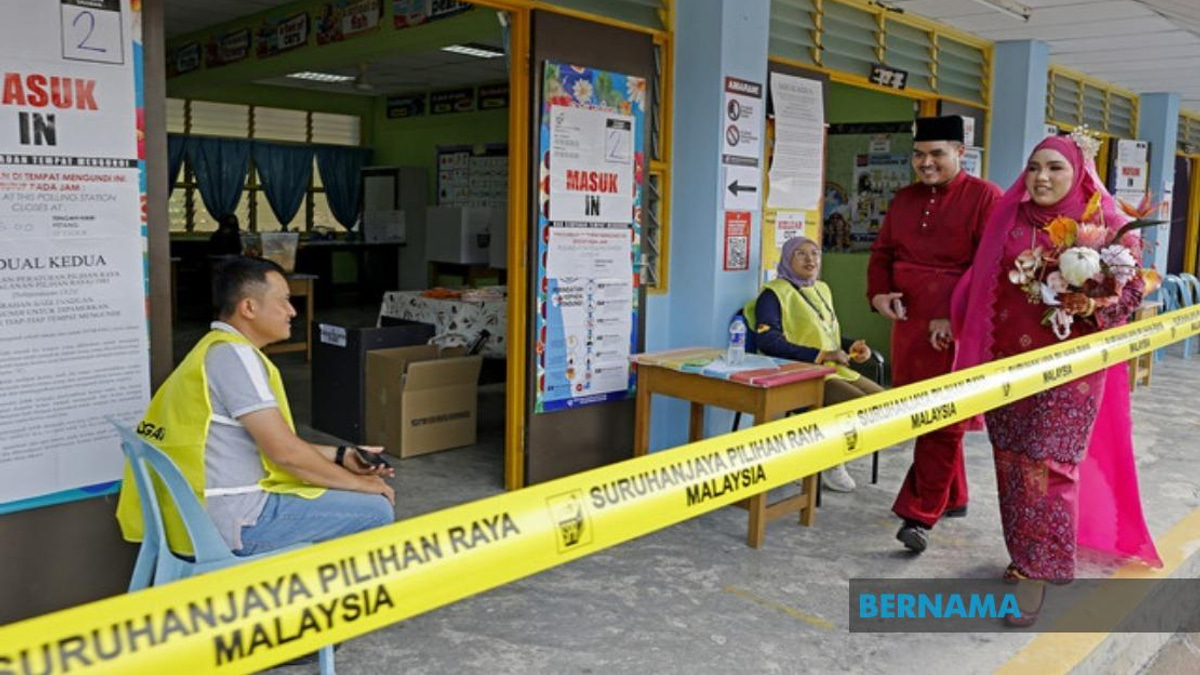 Young Bride Casts Vote in Traditional Wedding Attire at Negeri Sembilan Election