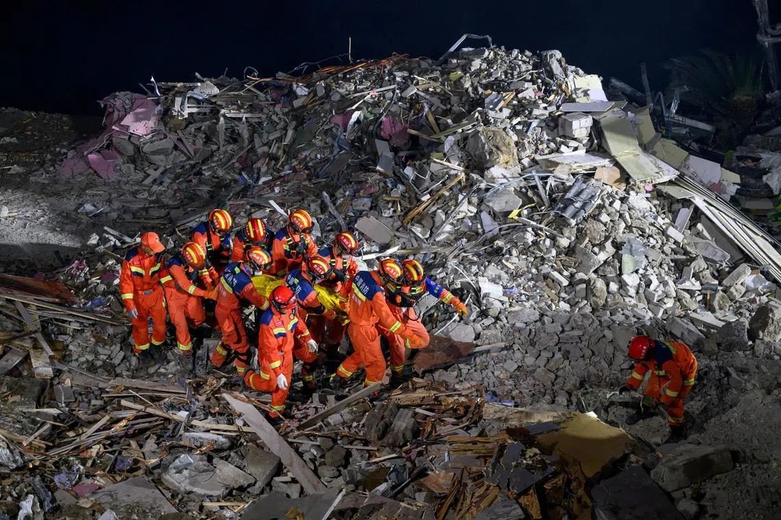 Chinese rescue teams blast through boulders to reach 34 missing after catastrophic landslide