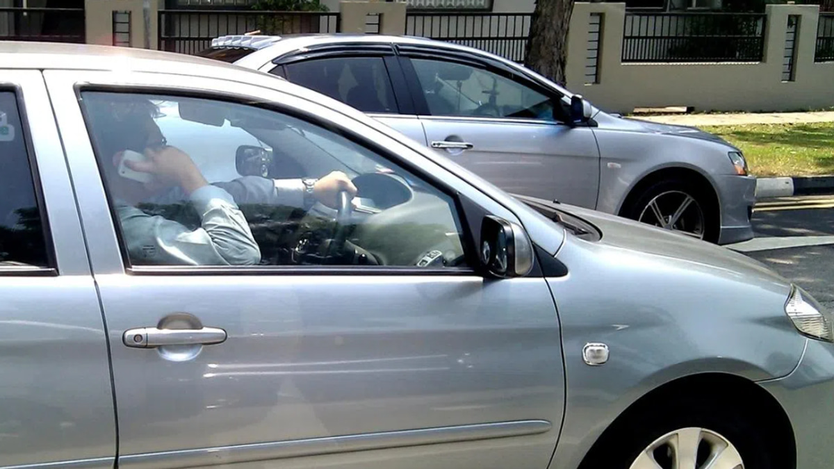Singapore to Impose Jail Time and Fines for Merely Holding a Phone While Driving