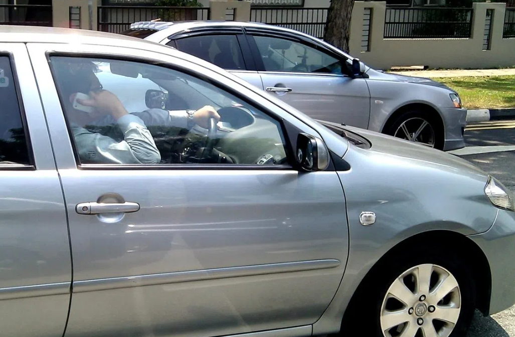 Singapore to Impose Jail Time and Fines for Merely Holding a Phone While Driving
